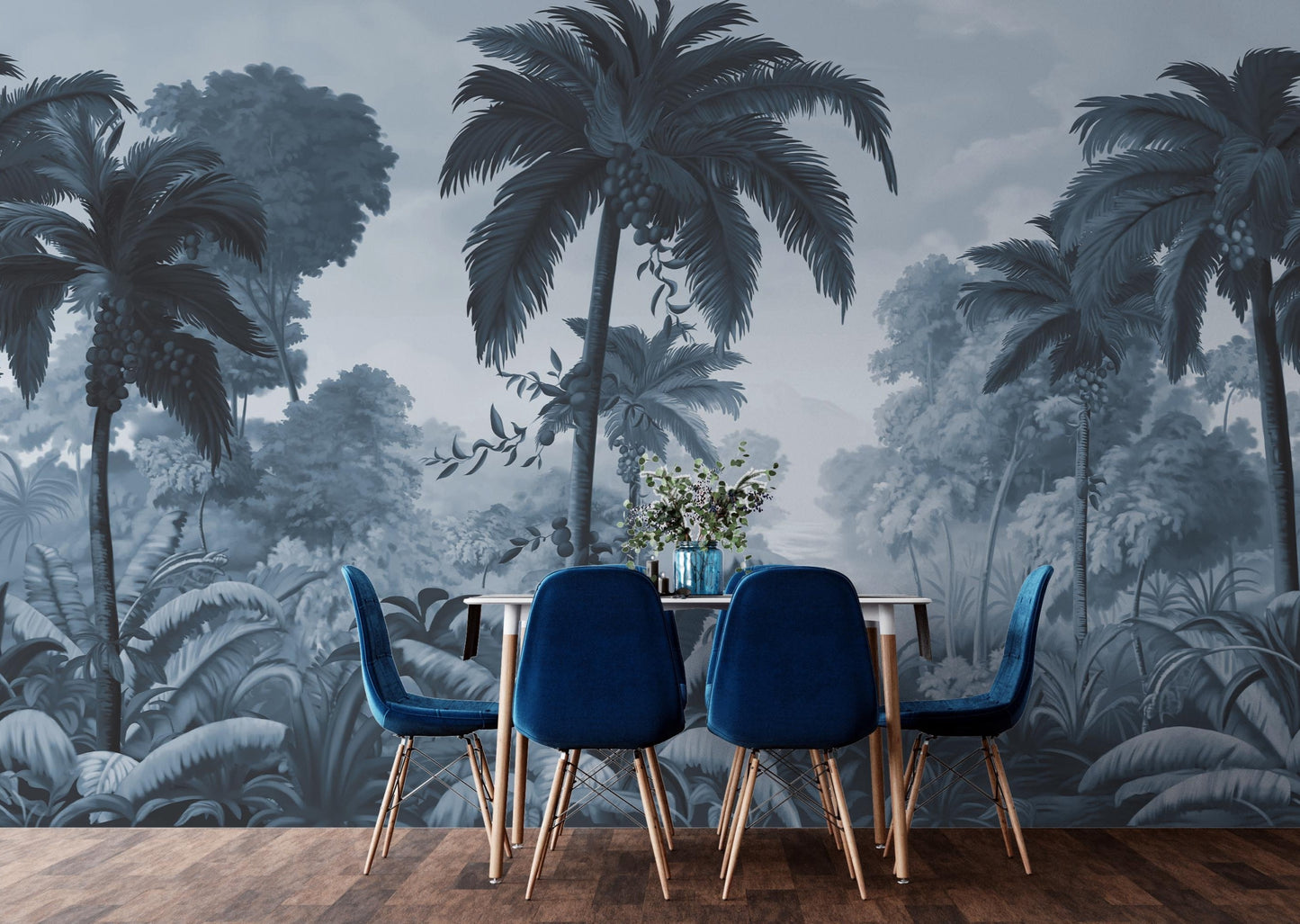 An architectural perspective of a contemporary lounge featuring the Luxe Tropical Greens Mural in Midnight Blue as a full-scale feature wall. The mural’s expansive jungle vista pairs elegantly with crisp white furniture and metallic accents, creating a peaceful and cultured interior sanctuary.