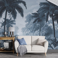 An architectural perspective of a contemporary lounge featuring the Luxe Tropical Greens Mural in Midnight Blue as a full-scale feature wall. The mural’s expansive jungle vista pairs elegantly with crisp white furniture and metallic accents, creating a peaceful and cultured interior sanctuary.