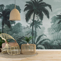 An architectural perspective of a contemporary lounge featuring the Luxe Tropical Greens Mural in Misty Morning as a full-scale feature wall. The mural’s expansive jungle vista pairs elegantly with light-toned furniture and minimalist decor, creating a peaceful and cultured interior sanctuary.