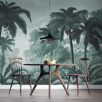 An architectural perspective of a contemporary lounge featuring the Luxe Tropical Greens Mural in Misty Morning as a full-scale feature wall. The mural’s expansive jungle vista pairs elegantly with light-toned furniture and minimalist decor, creating a peaceful and cultured interior sanctuary.
