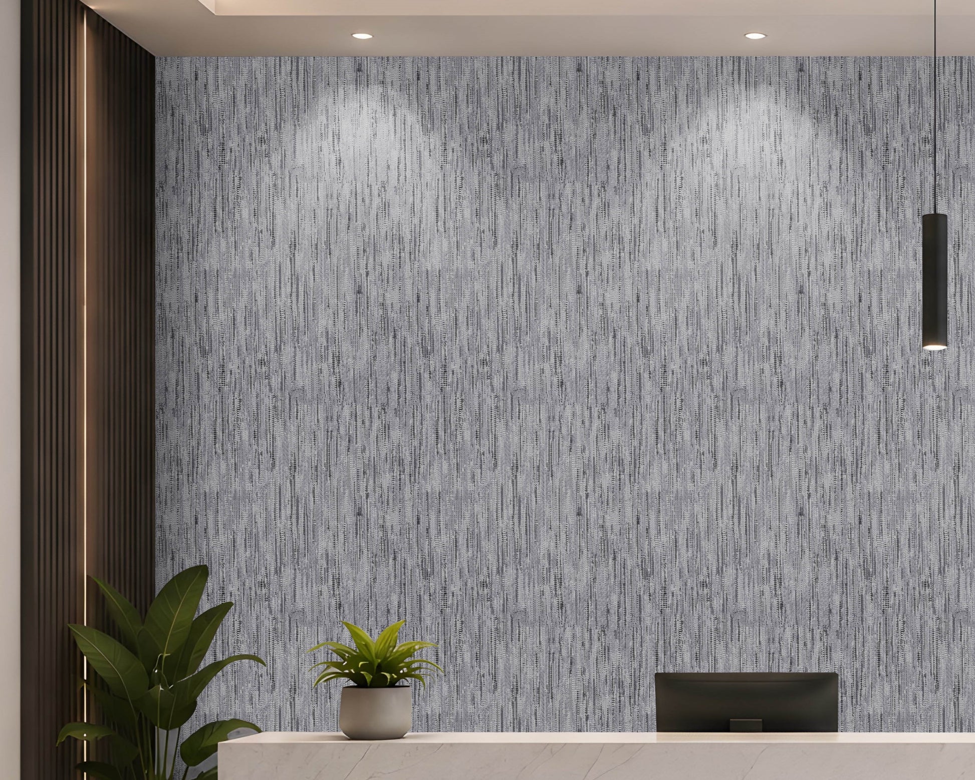A modern interior scene featuring a textured gray and white vertical brushstroke wallpaper on the back wall, with a white reception desk, a small potted plant, a computer monitor, and a dark wood slatted accent wall on the left.