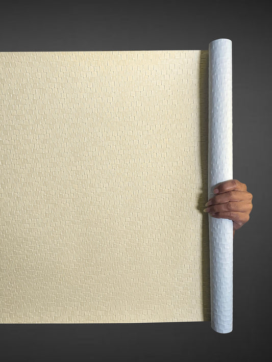 A high-resolution macro detail of Cream Checkered Deep Texture Wallcovering, highlighting the precise raised square grid. The image captures the smooth, creamy-beige finish and the way light defines the sharp edges and recessed borders of the geometric emboss.
