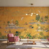 An architectural perspective of a spacious, modern living room featuring the Maharaja Garden Pichwai Mural as a full-scale narrative feature wall. The mural’s vibrant golden tones create a stunning contrast with blush-pink mid-century armchairs, light wood flooring, and a minimalist chandelier, blending traditional Indian opulence with contemporary design.