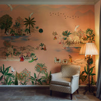 Maharaja Garden Pichwai mural wallpaper in terracotta peach featuring peacocks, cranes, lush botanical landscapes, palace architecture, and traditional Indian garden scenes in warm earthy peach tones.