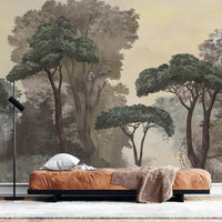 An architectural perspective of a contemporary lounge featuring the Mediterranean Reverie Forest Mural as a full-scale feature wall behind a cognac leather daybed. The mural’s expansive forest vista pairs strikingly with natural wood flooring and minimalist decor, creating a peaceful and cultured interior sanctuary.