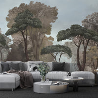 An architectural perspective of a contemporary lounge featuring the Mediterranean Reverie Forest Mural in Stormy Bay as a full-scale feature wall. The mural’s expansive forest vista pairs strikingly with crisp white furniture and metallic accents, creating a peaceful and cultured interior sanctuary.