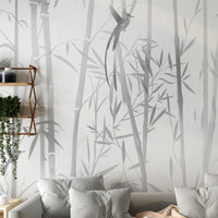 An architectural perspective of a contemporary sunlit lounge featuring the Mist Scenic Landscape Mural as a full-scale feature wall. The mural’s bold black silhouettes pair elegantly with charcoal gray upholstery, metallic accents, and light wood flooring, creating a sophisticated and high-contrast interior sanctuary.