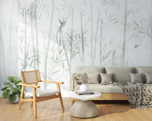 An architectural perspective of a contemporary sunlit lounge featuring the Mist Scenic Landscape Mural as a full-scale feature wall. The mural’s soft verdant tones pair elegantly with a light gray sofa, natural wood furniture, and woven rattan accents, creating a serene and sophisticated interior sanctuary.