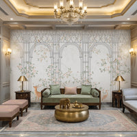 Morning Dew Trellis wallpaper featured in a luxurious living room, showcasing elegant powder blue trellis arches intertwined with delicate floral vines, blooming branches, birds, and botanical motifs. Surrounded by intricately carved wall panels, crystal chandeliers, plush seating, brass accents, and soft lighting, the mural creates a refined blend of classic elegance, garden-inspired beauty, and timeless sophistication.