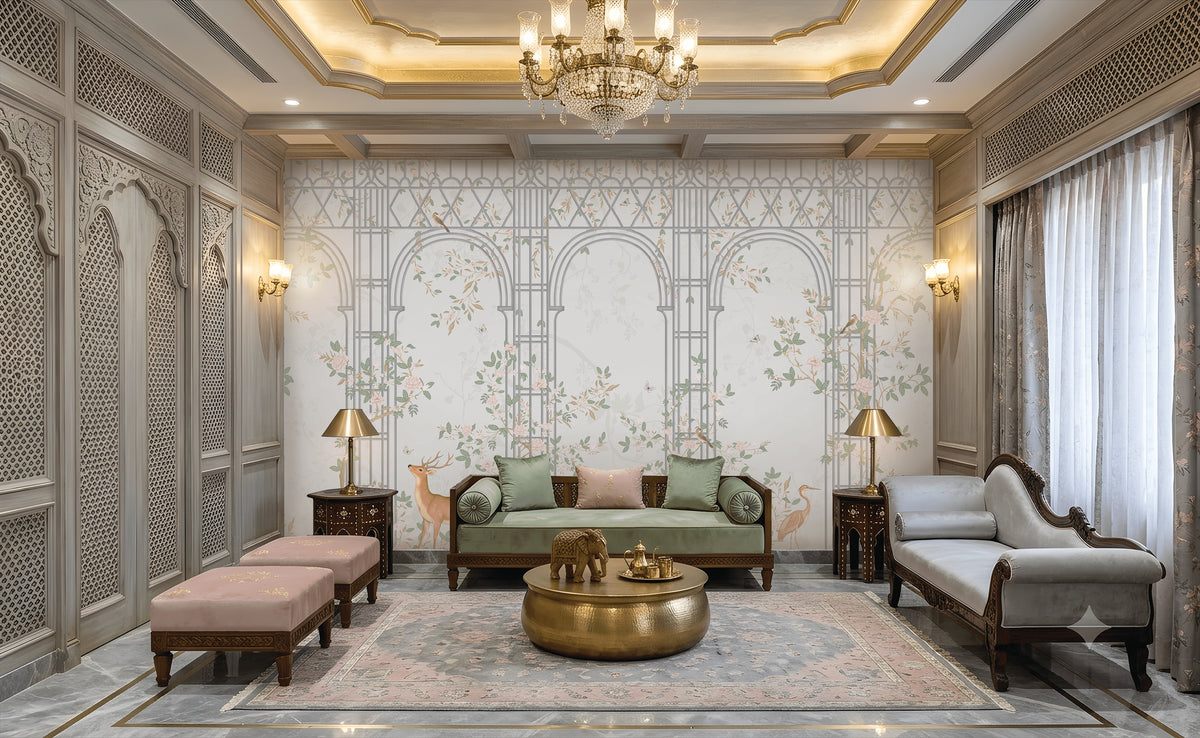Morning Dew Trellis wallpaper featured in a luxurious living room, showcasing elegant powder blue trellis arches intertwined with delicate floral vines, blooming branches, birds, and botanical motifs. Surrounded by intricately carved wall panels, crystal chandeliers, plush seating, brass accents, and soft lighting, the mural creates a refined blend of classic elegance, garden-inspired beauty, and timeless sophistication.