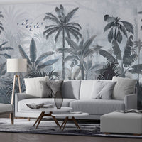 An architectural perspective of a high-end lounge area featuring the Mystic Rainforest Haven Mural in Night Rendezvous as a full-scale feature wall. The mural’s expansive botanical vista pairs elegantly with modern furniture and warm accent lighting, creating a peaceful and cultured interior sanctuary.