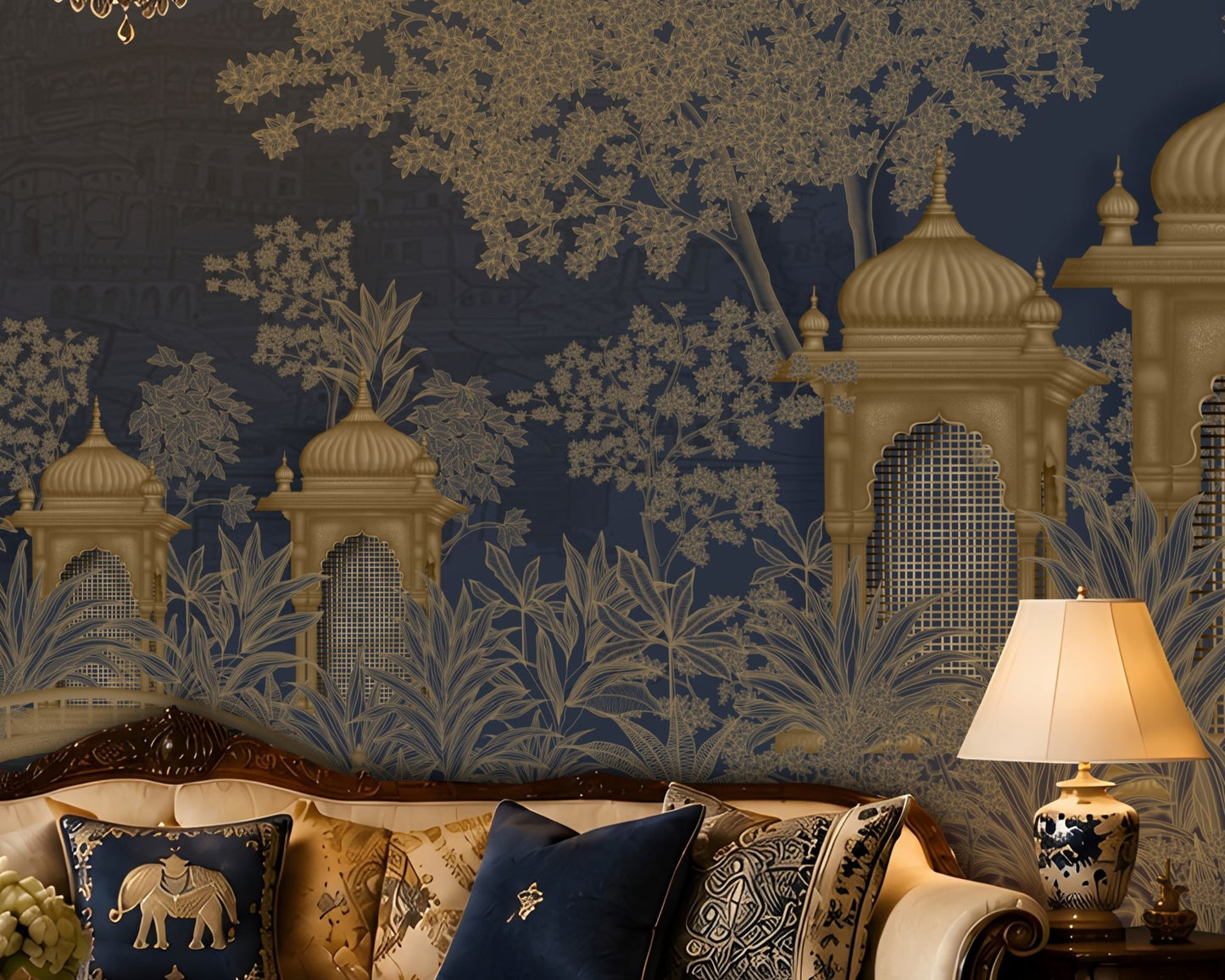 An ornate interior scene featuring a dark navy blue wallpaper with a gold and beige toile-style pattern of domes, trees, and foliage, behind a carved sofa with decorative pillows and a lit table lamp.