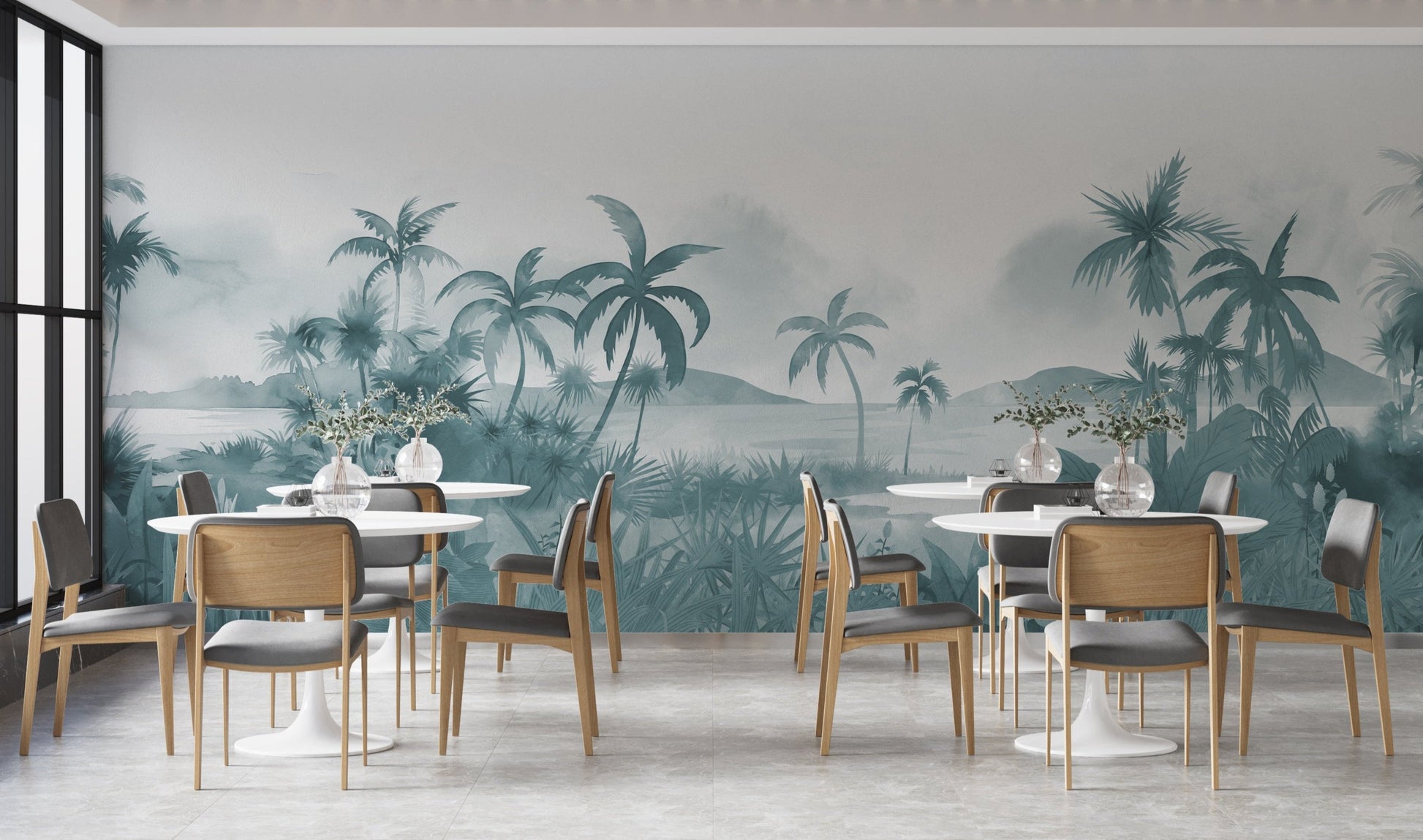An architectural perspective of a modern, low-profile lounge featuring the Panoramic Tranquility Mural in Payne Grey as a full-scale feature wall. The mural’s wide-angle coastal vista pairs strikingly with sleek stone surfaces and polished metal accents, creating a peaceful and cultured interior sanctuary.