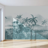 An architectural perspective of a modern, low-profile lounge featuring the Panoramic Tranquility Mural in Payne Grey as a full-scale feature wall. The mural’s wide-angle coastal vista pairs strikingly with sleek stone surfaces and polished metal accents, creating a peaceful and cultured interior sanctuary.