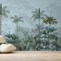 An architectural perspective of a high-ceilinged contemporary lounge featuring the Paradise Palms Mural in Arctic Blue as a full-scale feature wall. The mural’s expansive botanical vista pairs elegantly with crisp white furniture and polished metal accents, creating a peaceful and cultured interior sanctuary.