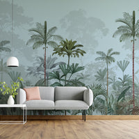 An architectural perspective of a high-ceilinged contemporary lounge featuring the Paradise Palms Mural in Arctic Blue as a full-scale feature wall. The mural’s expansive botanical vista pairs elegantly with crisp white furniture and polished metal accents, creating a peaceful and cultured interior sanctuary.