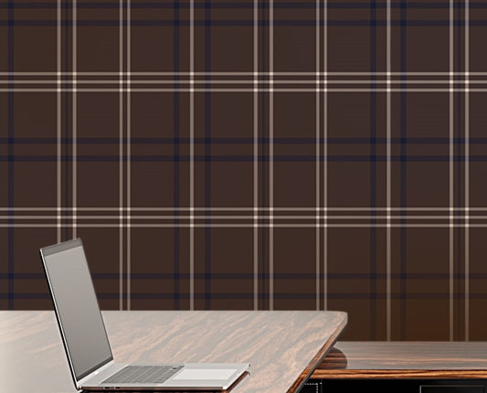 A bright, modern office features a desk setup with a brown plaid accent wall.
A glossy, dark wood desk holds an open laptop on its shiny surface.
Behind the desk, a matching storage cabinet holds a row of grey binders.
A high-backed office chair with a rich wood grain back faces the desk.
Light pours in from a large window on the right side of the room.
The room is complete with light-colored wood flooring and clean white walls.