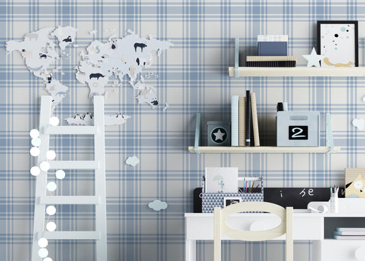 A charming children's study area features a soft pastel blue and white plaid wallpaper.
The detailed design shows intersecting light blue stripes forming grids on a white base.
In front, a small white desk setup with a wooden chair sits centered against the wall.
The playful space is complete with floating shelves, a toy wagon, and a decorative ladder.