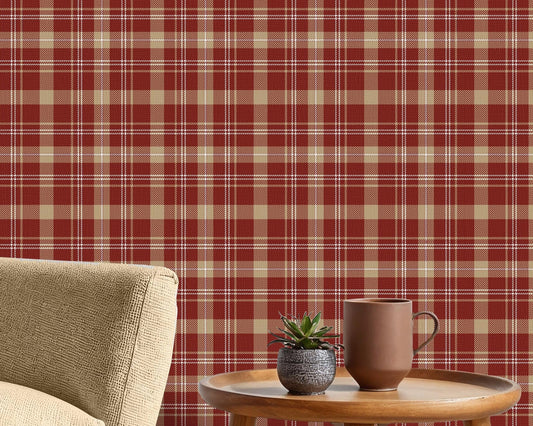 A close-up view displays wallpaper with a warm red background.
The design features a classic, tight plaid and tartan pattern.
It includes a mix of thick beige stripes that form large blocks.
Fine white lines crisscross over the grid, adding detailed accents.
The colors combine deep red, soft tan beige, and crisp white lines.
The overall pattern has a textured fabric appearance in a traditional style.
