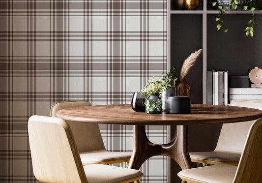 A cozy dining area features a classic warm brown and cream plaid wallpaper.
The detailed design shows intersecting brown stripes forming grids on a light base.
In front, a round wooden dining table is surrounded by four matching chairs.
A tall, dark grey open bookshelf stands on the right side to complete the space.