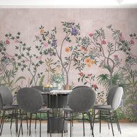 Primrose pink Vaatika II floral mural wallpaper elegant botanical wall design in modern living room.
