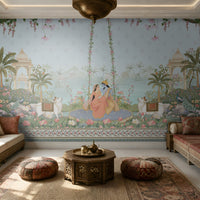 Radha Madhav heritage wall mural in a luxury Indian living room with carved wooden sofas, patterned cushions, brass décor, and traditional rugs.