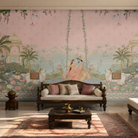 Radha Madhav pink heritage wall mural in a luxury Indian living room with carved wooden seating, floral cushions, brass décor, and traditional rug.