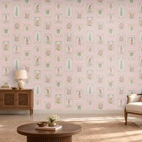 Soft blush pink heritage wallpaper featuring delicate floral patterns, traditional Indian miniature illustrations, intricate vintage-style frames, and muted sage green botanical accents on a pastel pink background, perfect for elegant and timeless Indian-inspired interiors.