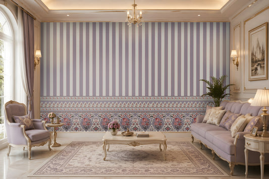 Elegant living room featuring pastel lavender striped wallpaper with an ornate floral border inspired by Persian and Mughal motifs. Styled with classic lilac upholstered furniture, gold accents, and luxurious décor, creating a timeless heritage-inspired interior.