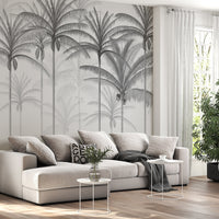 An architectural perspective of a spacious living room featuring the Rising Palms Mural in Pewter Grey as a full-scale feature wall. The mural’s vertical palm composition pairs elegantly with sleek stone surfaces and polished metal accents, creating an airy and sophisticated interior sanctuary.
