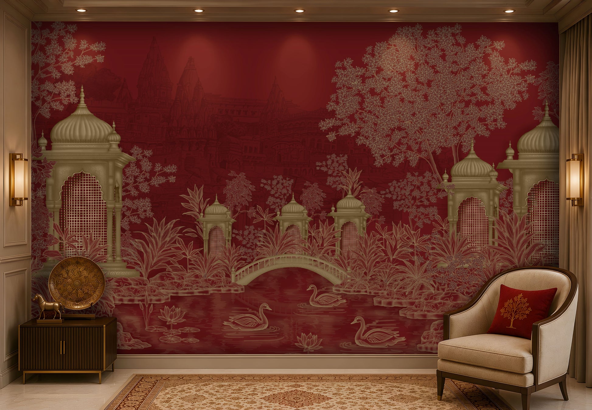 Elegant living room featuring a heritage-inspired mural in rich crimson red and antique gold. The mural showcases ornate domed pavilions, lush botanical foliage, an arched bridge, blooming lotus flowers, and graceful swans on a tranquil pond, with subtle palace architecture in the background. The space is styled with a cream upholstered accent chair, a burgundy embroidered cushion, dark wood furniture, brass decorative accents, a patterned beige rug, and warm ambient lighting, creating a luxurious atmospher