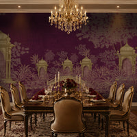 Royal Garden Heritage Wallpaper in luxury purple featuring Mughal-inspired pavilions, lush botanical gardens, an arched bridge, and intricate gold detailing, styled as an elegant dining room wall mural.
