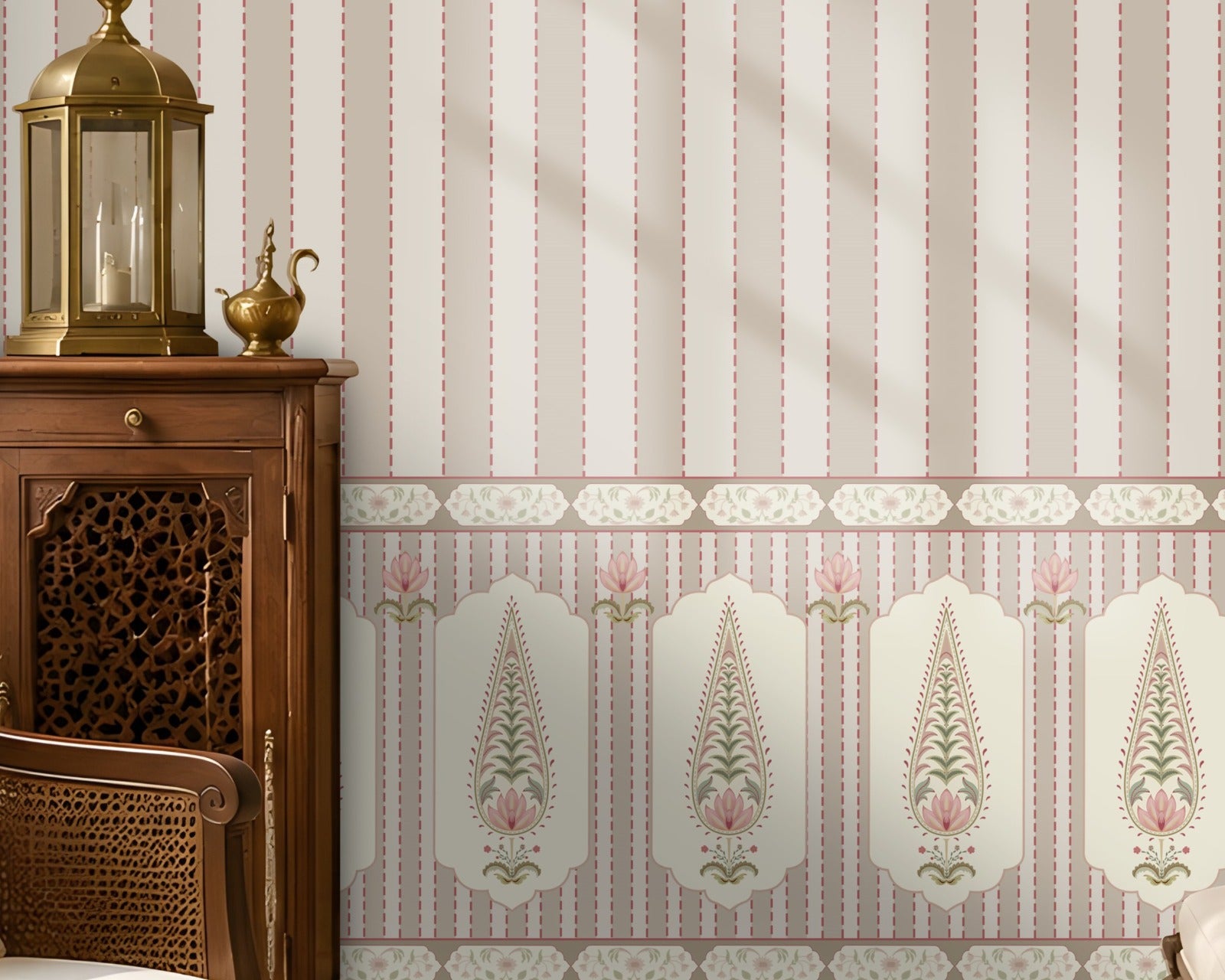 A styled interior room showing wallpaper with vertical pink and cream stripes and a decorative border along the lower portion. A wooden chair with a white embroidered pillow, a small wooden cabinet with a brass lantern, a bench, rug, and window are visible.