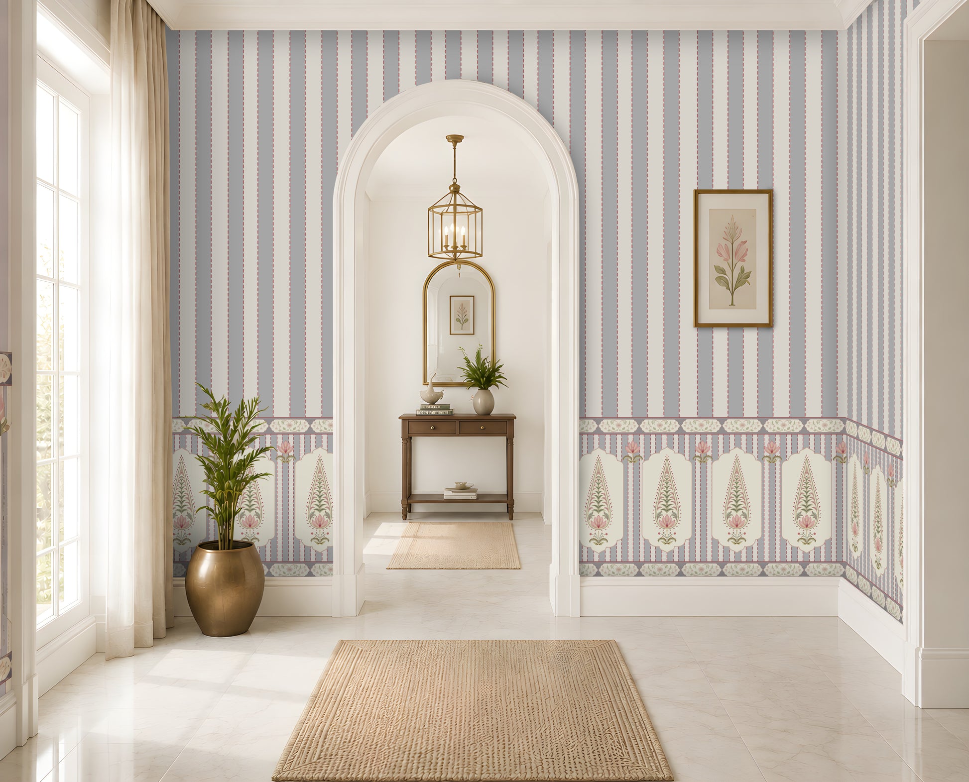 A beautifully styled interior hallway featuring light blue and white vertical striped wallpaper with a decorative border, white walls, a beige woven rug, a potted plant, and an arched doorway in the background.