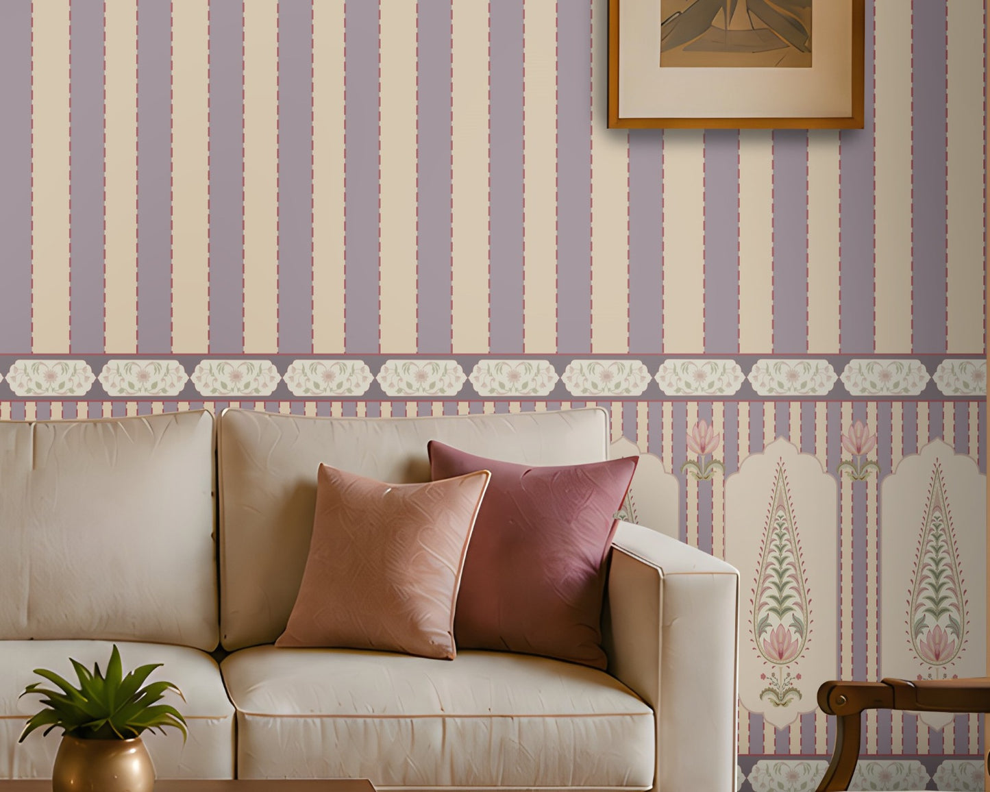 A styled living room featuring lavender and cream vertical striped wallpaper as the main product, shown in a complete interior setting with a beige sofa, wooden coffee table, patterned rug, and an armchair.