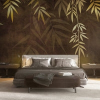 An architectural perspective of a contemporary lounge featuring the Sasa Leaves Mural in Bronze Brown as a full-scale feature wall. The mural’s warm, earthy tones pair elegantly with leather upholstery, natural wood flooring, and soft ambient lighting, creating a balanced and cultured interior sanctuary.