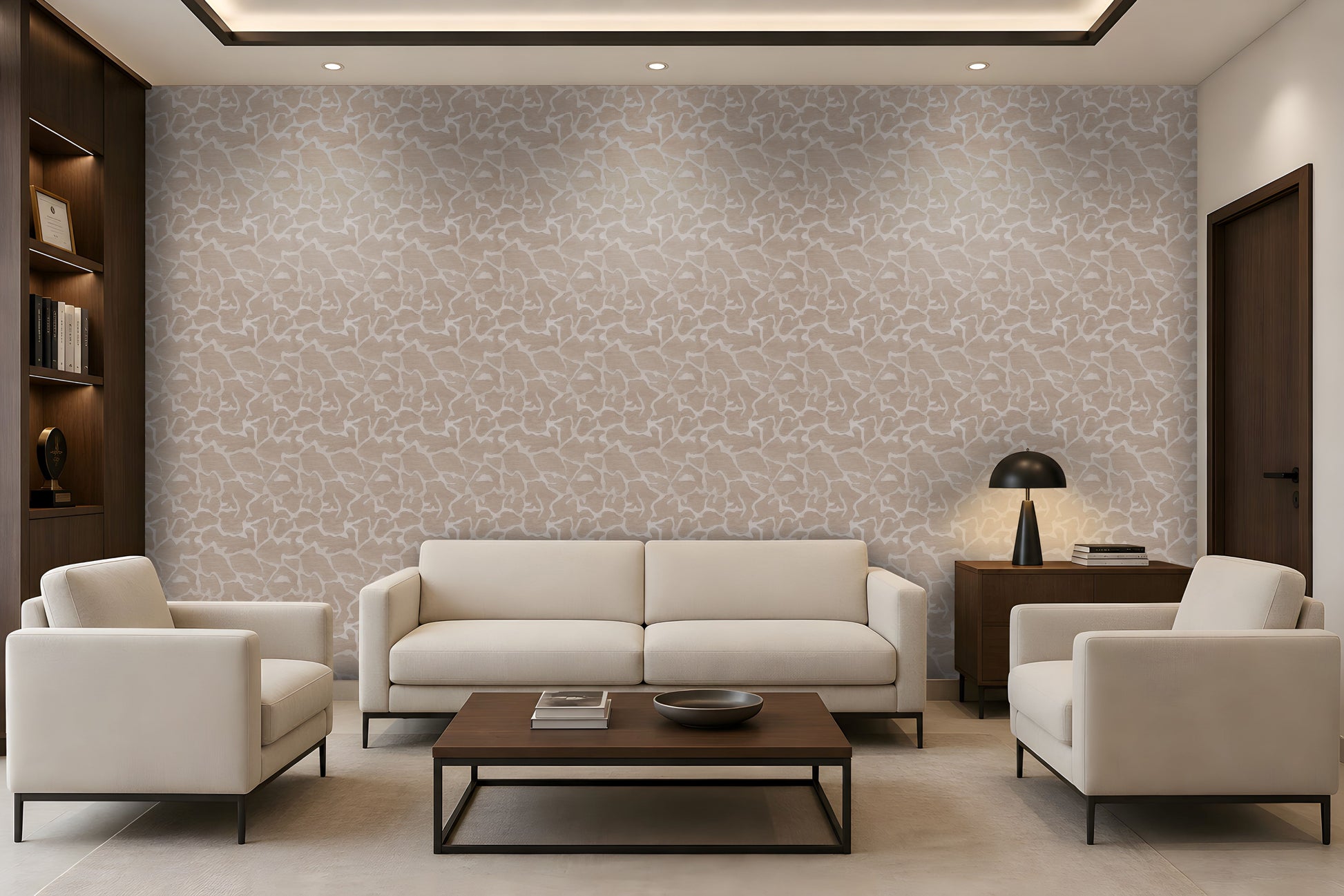 A modern living room featuring a large wall covered in beige and white abstract patterned wallpaper, styled with a cream sofa, two matching armchairs, a dark wood coffee table, and a black table lamp.