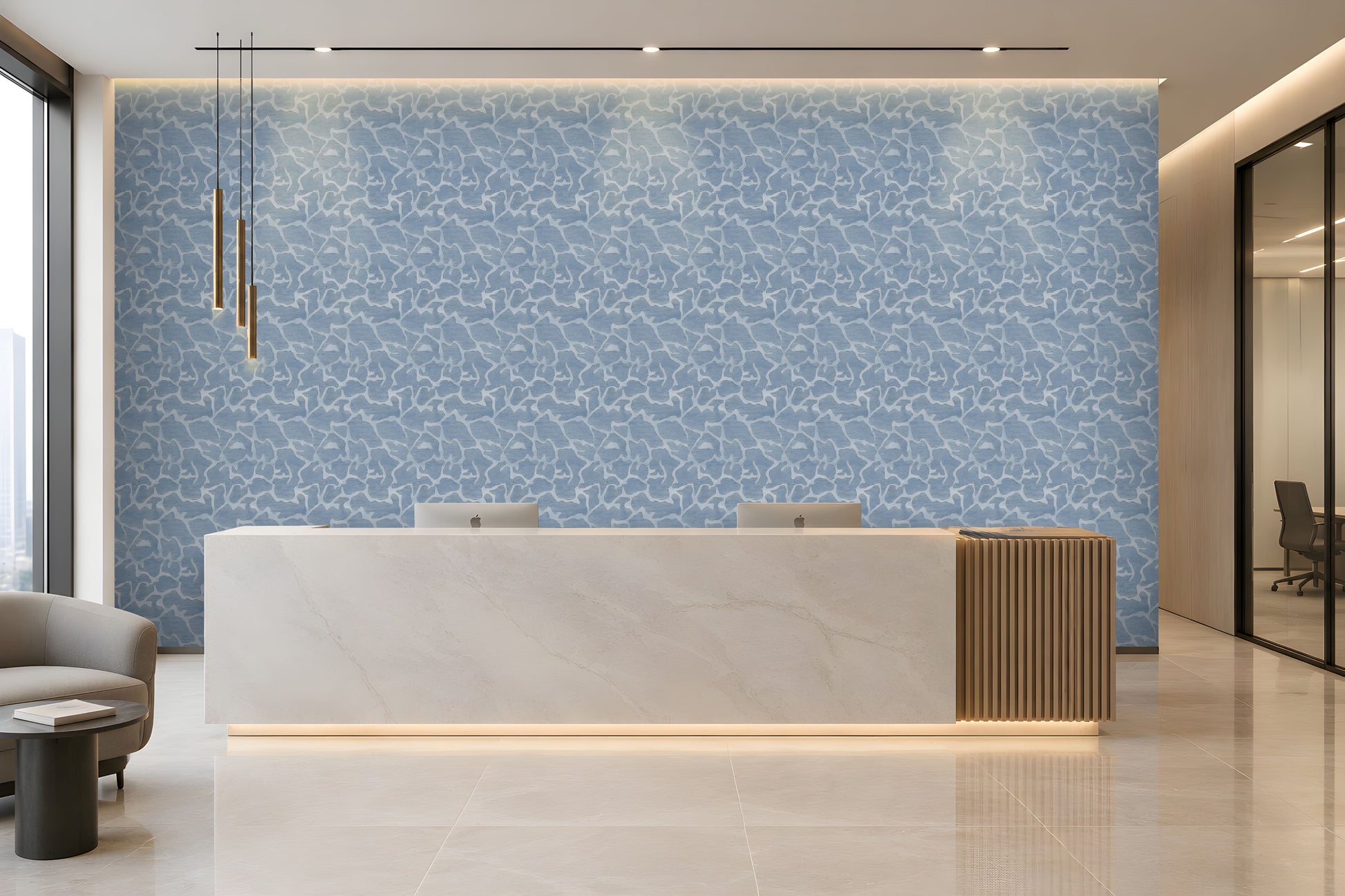A modern reception desk in a bright, contemporary office lobby. The desk features a white marble top with a vertical slatted wood side panel and a warm under-glow.