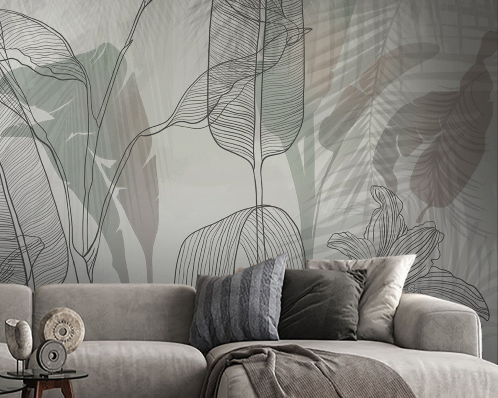 A high-resolution detail of the Shadowleaf Symphony Tropical Wallpaper, highlighting the intricate sketch-style outlines and the delicate, hand-drawn veining of the oversized leaves. The image showcases the artistic layering of charcoal line art against a misty, neutral background of soft grey and taupe.