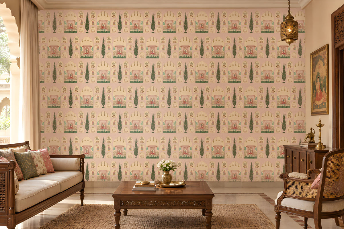 Shriji Darbar Heritage Wallpaper in soft powder pink with intricate Indian palace architecture, royal darbar scenes, decorative arches, and cypress tree motifs in a seamless repeating pattern, displayed in a traditional luxury living room with carved wooden furniture and warm ethnic décor.