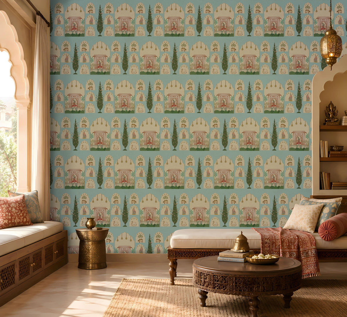 Shriji Darbar Heritage Wallpaper in soft sky blue featuring traditional Indian palace arches, royal court scenes, ornamental motifs, and elegant cypress trees in a seamless repeating pattern, showcased in a sophisticated living room with carved wooden furniture, brass accents, and warm natural light.