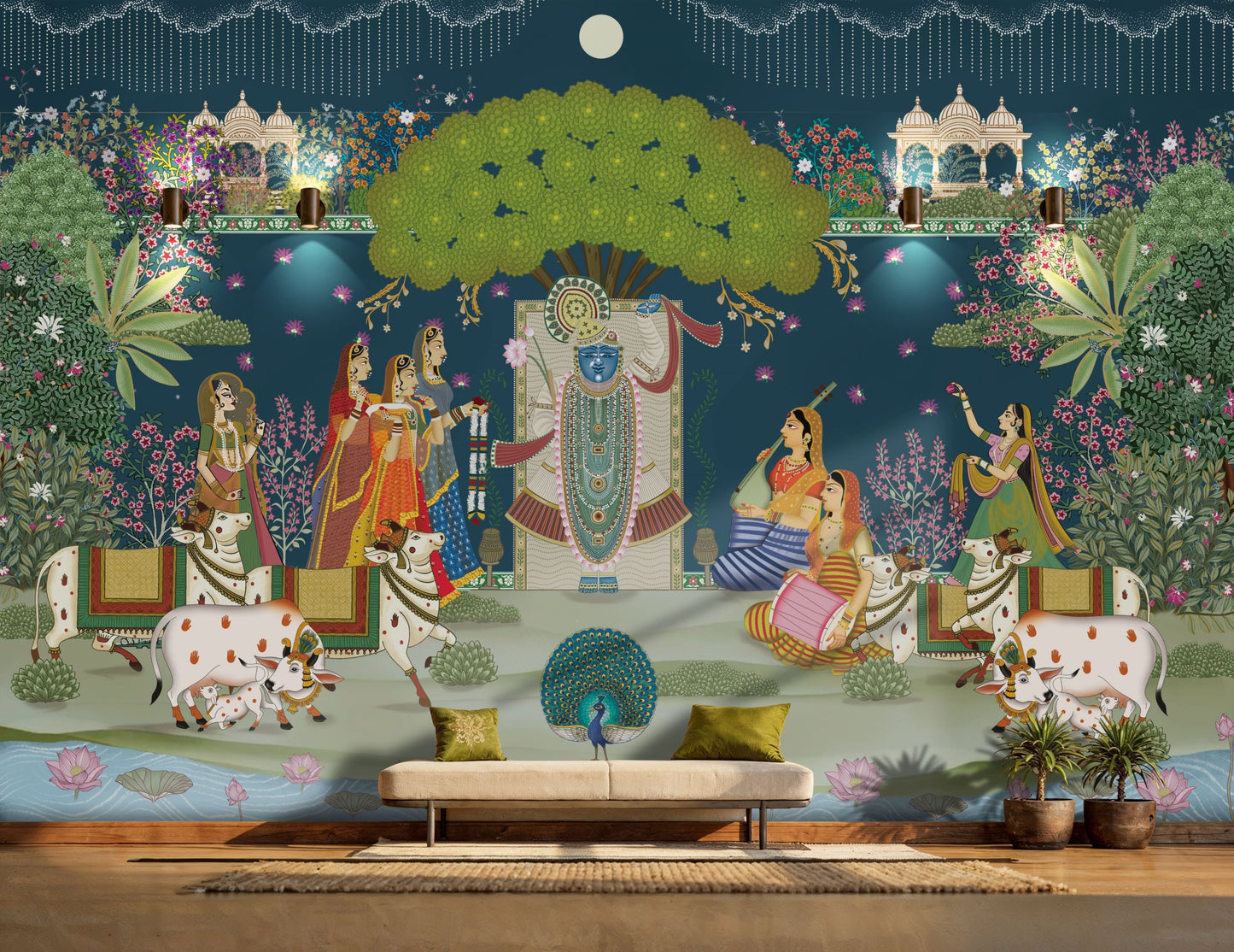 A traditional Pichwai wall mural depicting Lord Shrinathji with Gopis and holy cows under a large green tree against a deep blue background in a luxury living room.