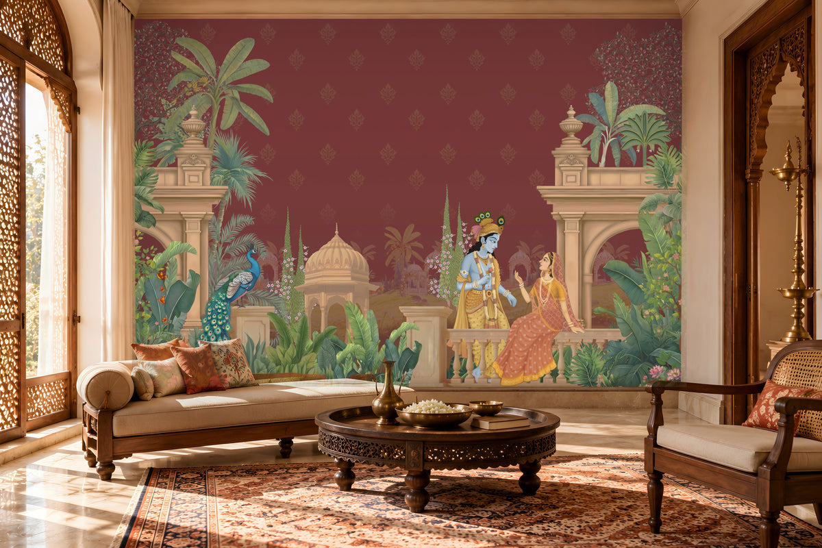 A large wall mural featuring a traditional Indian scene with Lord Krishna and Radha, peacocks, and architectural motifs, displayed in a beautifully decorated living room with a sofa, armchair, and wooden coffee table.