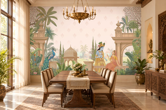 A styled dining room featuring a large wall mural with a classical Indian scene, including a peacock, pillars, and figures in traditional attire. The room is furnished with a wooden dining table, six upholstered chairs, a brass chandelier, and decorative plants.
