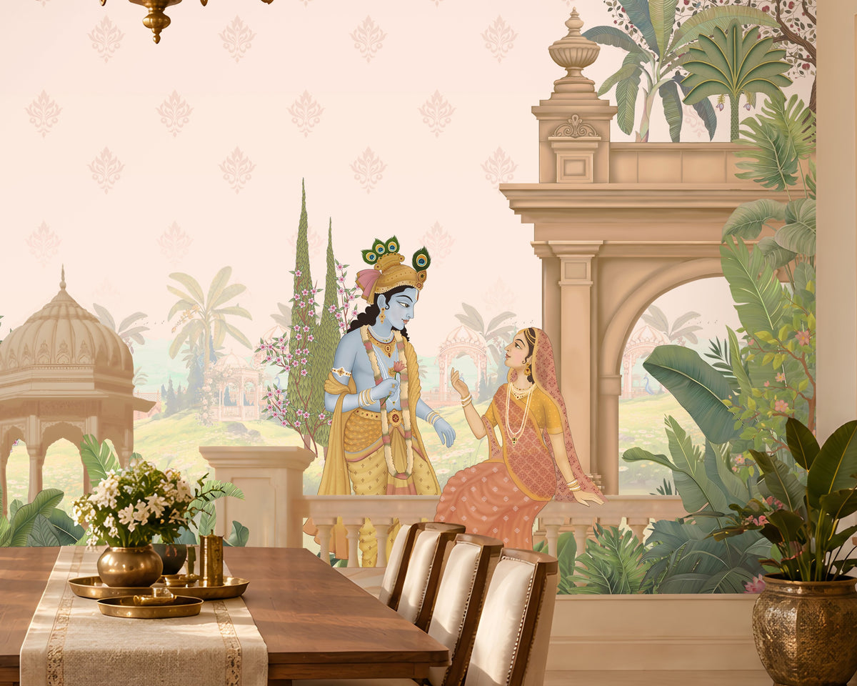 A styled dining room featuring a large wall mural with a classical Indian scene, including a peacock, pillars, and figures in traditional attire. The room is furnished with a wooden dining table, six upholstered chairs, a brass chandelier, and decorative plants.