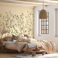 Soft yellow botanical peony mural wallpaper sophisticated accent wall in stylish bedroom.
