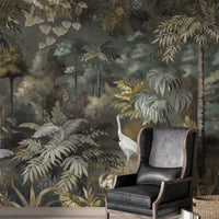 An architectural perspective of a sophisticated lounge featuring this Solitude Forest Tropical Wallpaper as a full-scale feature mural. The dark, immersive jungle scene creates a dramatic backdrop that pairs elegantly with vertical wood paneling, contemporary white furniture, and vibrant indoor greenery.