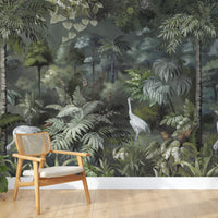 An architectural perspective of a refined interior featuring this Solitude Forest Tropical Wallpaper as a full-scale feature wall. The Forestwood palette creates a warm, immersive environment that pairs seamlessly with natural wood paneling, mid-century modern furniture, and soft, neutral textiles.