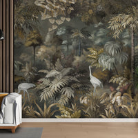 An architectural perspective of a sophisticated lounge featuring this Solitude Forest Tropical Wallpaper as a full-scale feature mural. The dark, immersive jungle scene creates a dramatic backdrop that pairs elegantly with vertical wood paneling, contemporary white furniture, and vibrant indoor greenery.