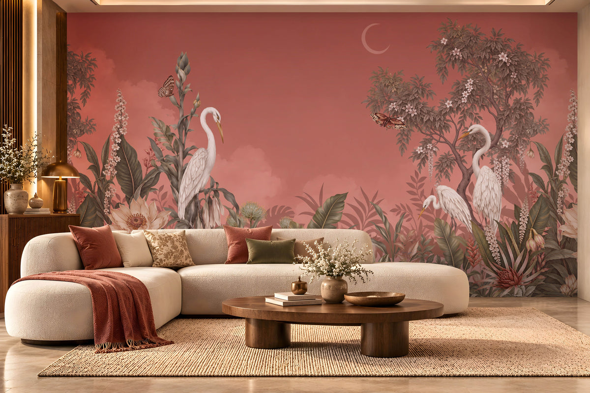 Vintage-style botanical mural wallpaper featuring elegant white herons, blooming flowers, lush tropical foliage, butterflies, and a crescent moon against a coral peach sky background.